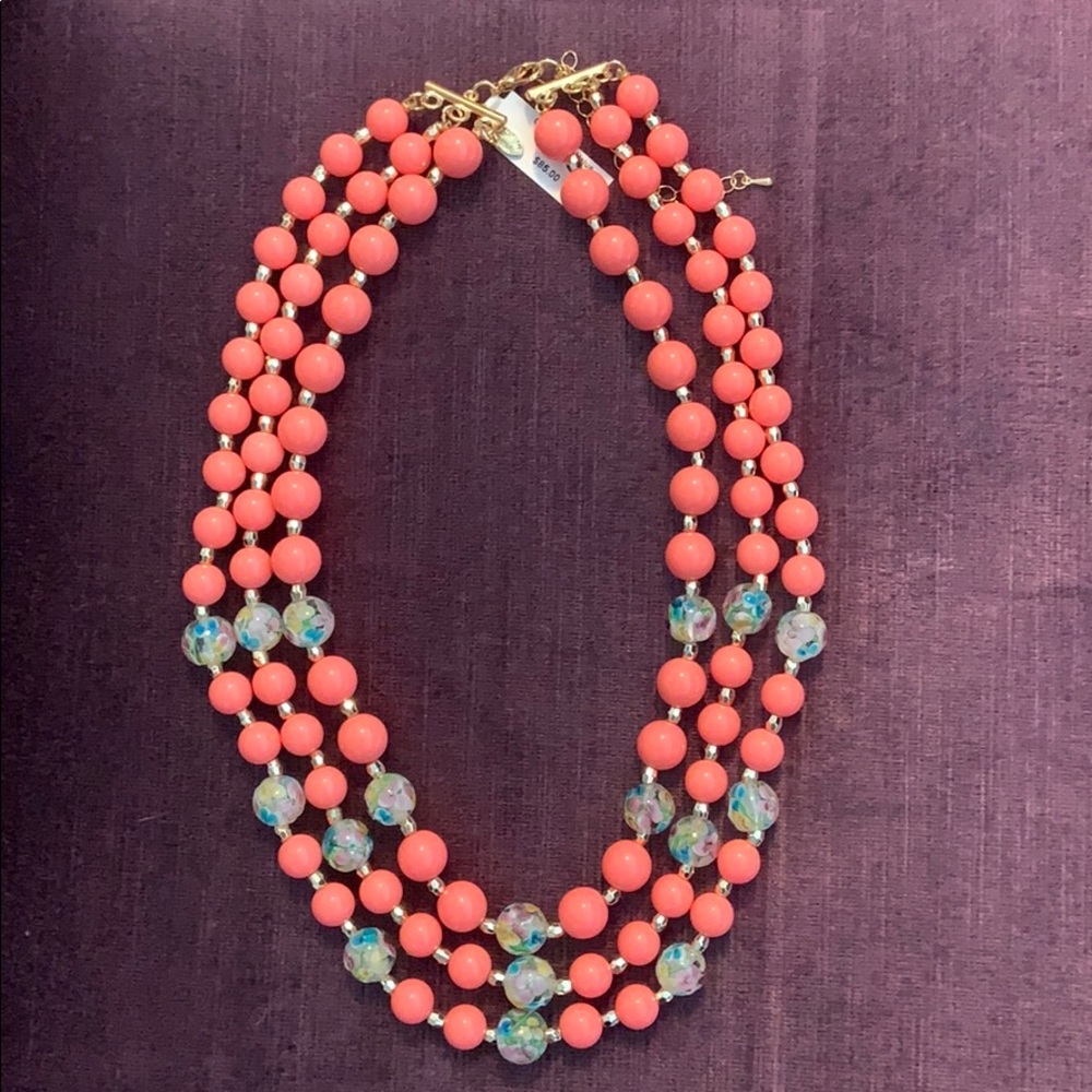 Coral beaded necklace with floral bead accents